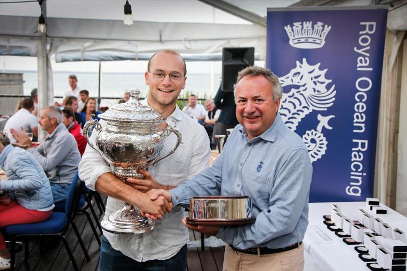 Receiving the RORC Transatlantic race Trophy from RORC Commodore, James Neville photo copyright Paul Wyeth / pwpictures.com taken at Royal Ocean Racing Club and featuring the Class 40 class
