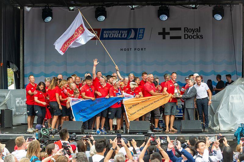Qingdao team celebrating victory in the Clipper 2019-20 Race on stage in London's Royal Docks photo copyright Jason Bye taken at  and featuring the Clipper 70 class
