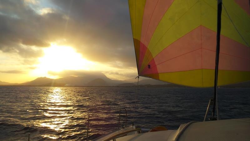 Spinnaker up, into the sunset photo copyright Mission Ocean taken at  and featuring the Cruising Yacht class