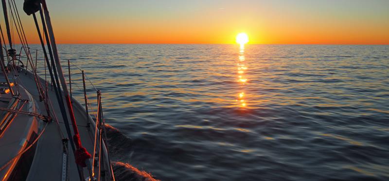 Atlantic sunrise, off the Carolina Coast photo copyright SV Crystal Blues taken at  and featuring the Cruising Yacht class