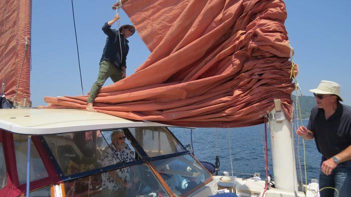 Glen Wilson and skipper Daniel Springett raising the sails on Tiare while Stephen Carlman steers photo copyright Stephen and Nancy Carlman taken at  and featuring the Cruising Yacht class
