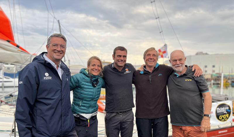 Yannick Moreau, mayor of Le Sables D'Olonne (L) and Don McIntyre (R), welcome Nikki Curwen, Damien Guillou and Simon Curwen in the early hours of the morning photo copyright Golden Globe Race taken at  and featuring the Golden Globe Race class
