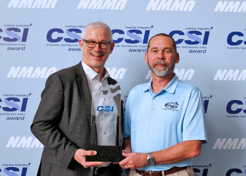 L-R: National Marine Manufacturers Association President, Frank Hugelmeyer, presents Todd Leggett, Grady-White Boats Dealer/Customer Relations Manager, with the 2021 NMMA Marine Industry Customer Satisfaction Index Award at the Miami Boat Show photo copyright Grady-White taken at 