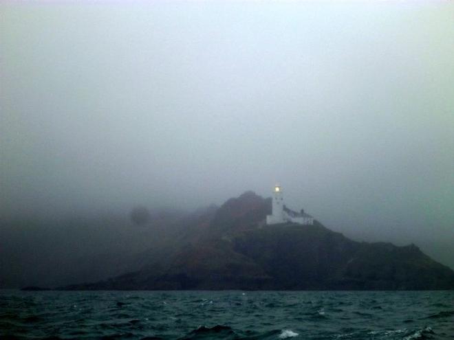 Start Point lighthouse looms in the mist © SV Taipan