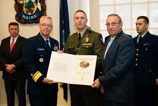 Governor Paul R. LePage and Rear Adm. Steve Poulin awards Sergeant Matt Talbot the Certificate of Valor in the Maine State House Tuesday, March 28, 2017. Talbot received the award for actions he took when a 40-foot lobster boat began operating in an uncontrolled manner dangerously close to the rocky shore and local maritime traffic. © Petty Officer 3rd Class Andrew Barresi