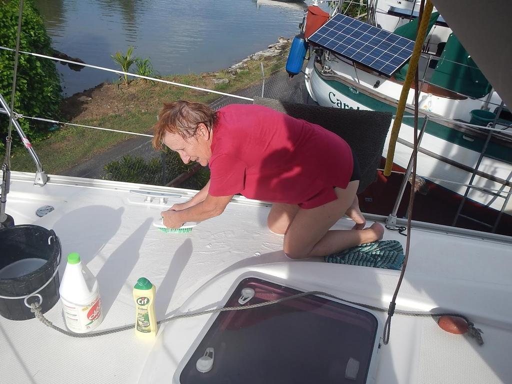 Scrubbing the deck © Freedom and Adventure