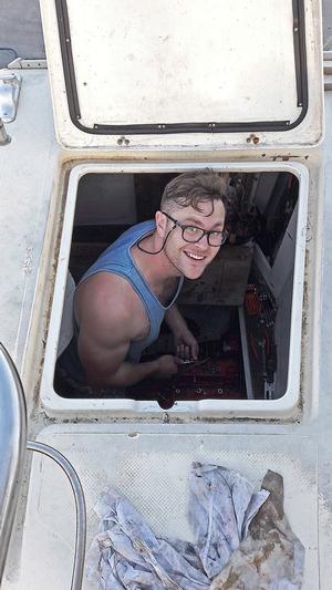 Volunteer Cameron down in the engine compartment photo copyright Mission Océan taken at  and featuring the  class