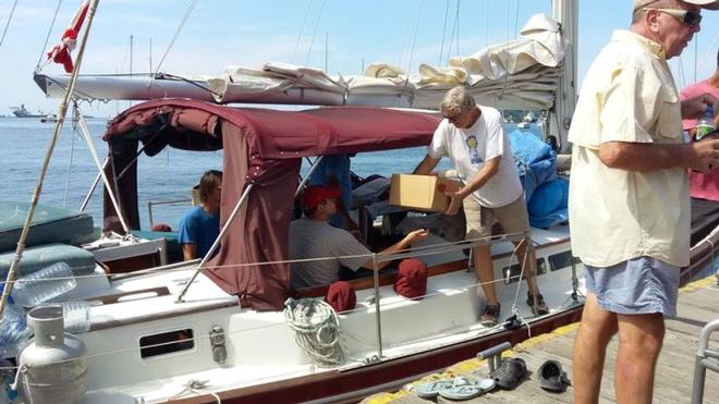 Loading the boat for the trip to Dominica ©  Ocean Cruising Club