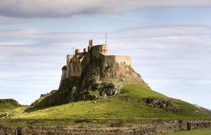 This photo of Lindisfarne Castle from Wikipedia without all the scaffolding photo copyright SV Taipan taken at  and featuring the  class