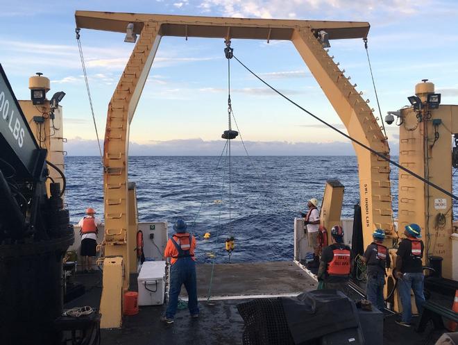 Crew members deploy a high-frequency acoustic recording package to detect cetacean sounds underwater © NOAA Fisheries