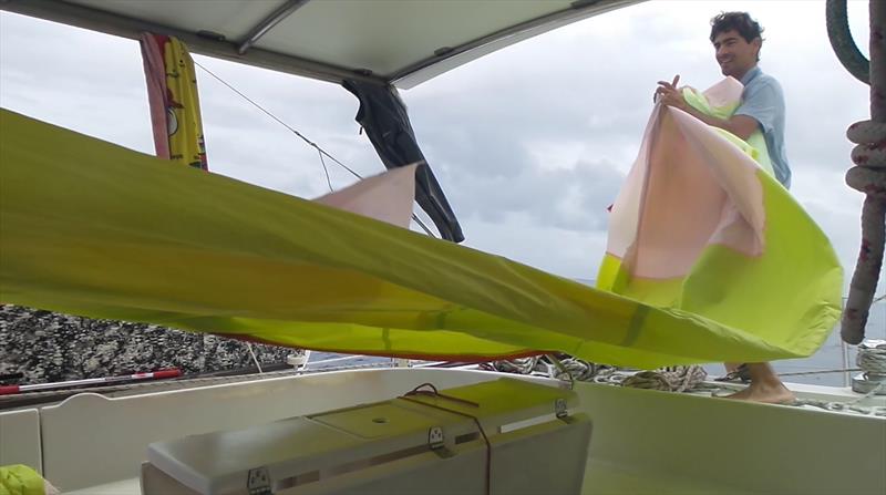 Packing the poor old spinnaker away photo copyright Mission Ocean taken at  and featuring the Cruising Yacht class