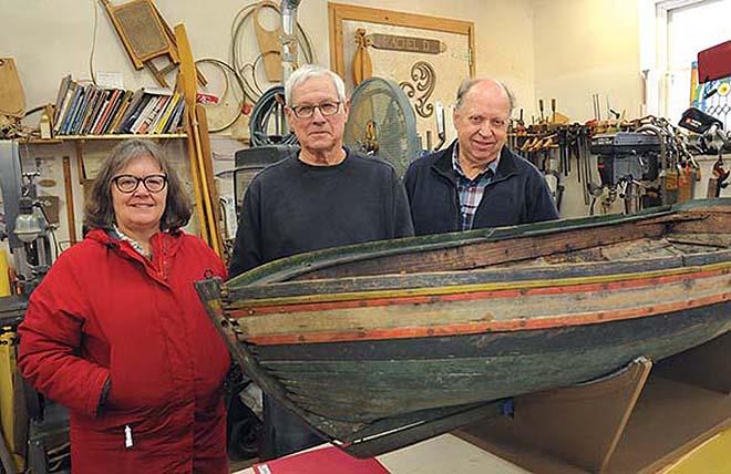 Rokeby Museum Director Catherine Brooks, left, furniture maker and boatbuilder Don Dewees and conservationist Rick Kerschner stand with a child's boat that was found in a museum outbuilding and is now being conserved and readied for exhibition photo copyright Trent Campbell taken at  and featuring the Cruising Yacht class
