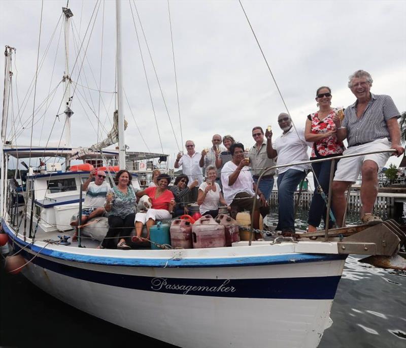 Sea conquerer: Adventurer Peter Quentrall-Thomas celebrates aboard the Passagemaker in Chaguaramas on Friday with his wife and friends after sailing across the Atlantic Ocean photo copyright newsday taken at  and featuring the Cruising Yacht class