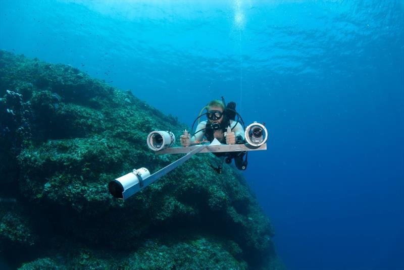 Scuba diver Brett Taylor uses stereo-video technology to survey fish assemblages on outer reef slopes photo copyright Steven Lindfield taken at  and featuring the Cruising Yacht class