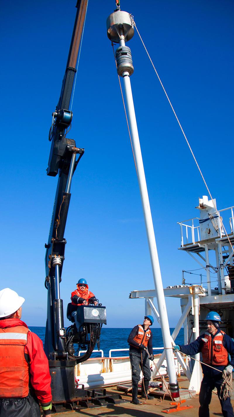 A crew retrieves a sediment core drilled from seafloor. A new study provides first comprehensive analysis of ocean-based sediment records to demonstrate that Atlantic Ocean's overturning circulation began to weaken near the end of Little Ice Age - photo © Ian Hall, Cardiff University