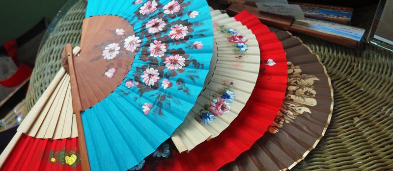 Local crafts - Hand painted fans - Yes we bought one - photo © Neil Langford, SV Crystal Blues