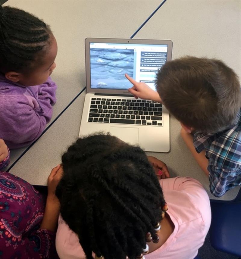 Second graders from an elementary school in Memphis, TN work together to classify images on Steller Watch photo copyright NOAA Fisheries taken at  and featuring the Cruising Yacht class