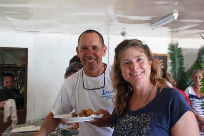 2018-19 World ARC - Rick and Brenda from Amara enjoy the Tongan feast at Ene'io Beach and Botanical Garden photo copyright World Cruising taken at  and featuring the Cruising Yacht class