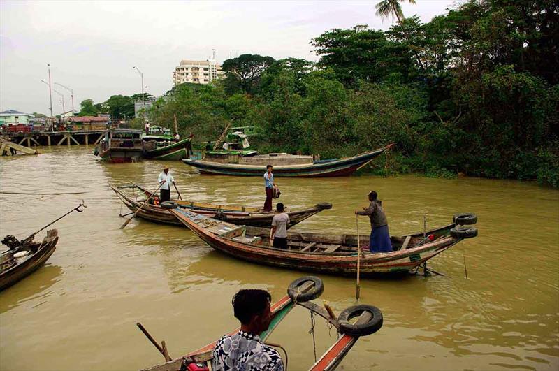 In bustling Yangon Harbor, locals use traditional boats for fishing and ferry services.  - photo © Florin Filip, The Institute for Fluvial and Marine Systems, Bucharest, Romania