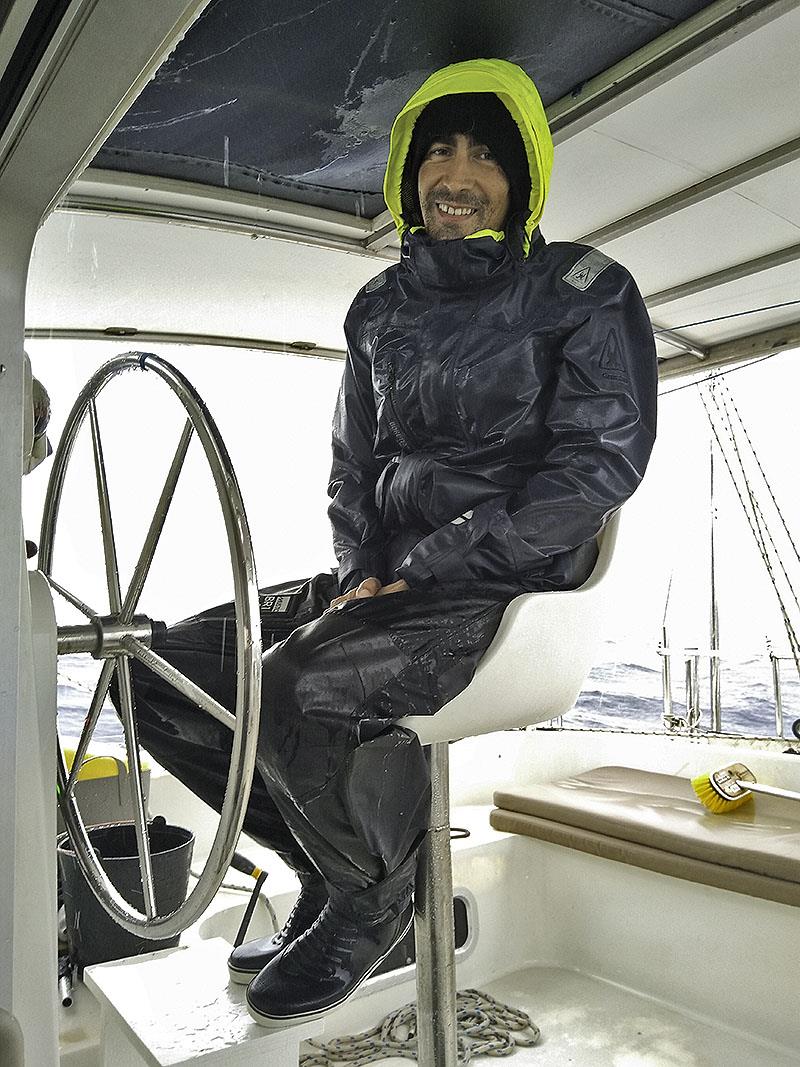 A soggy Henrique at the helm photo copyright Mission Ocean taken at  and featuring the Cruising Yacht class