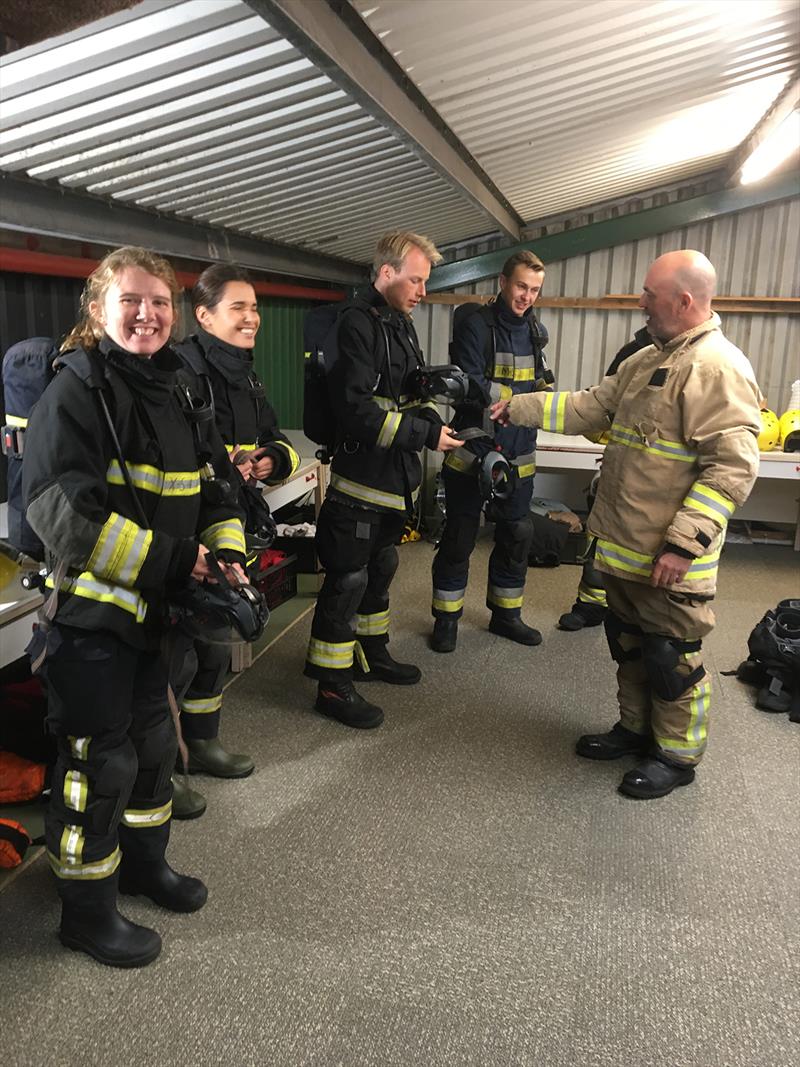 Donning fire fighting kits and breathing apparatus photo copyright Tim Eady taken at  and featuring the Cruising Yacht class