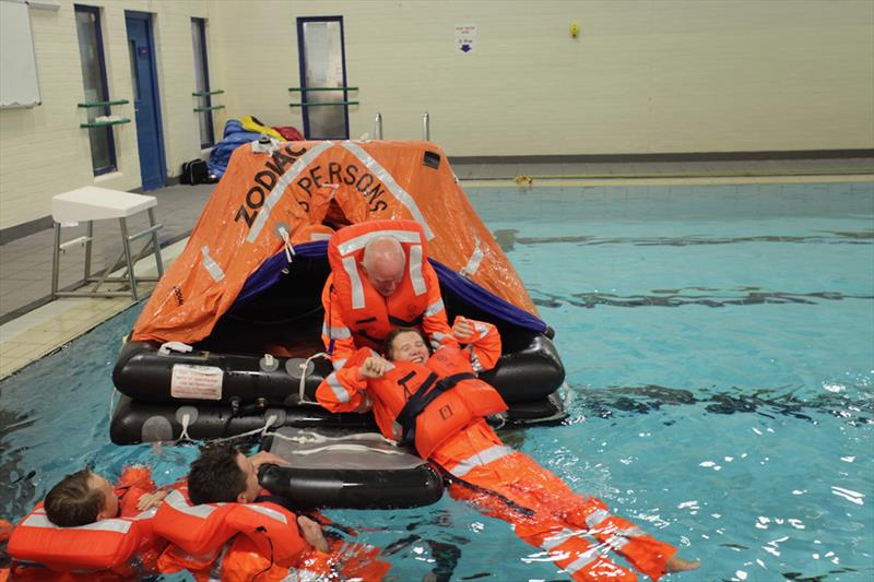 Acting as a casualty in the liferaft photo copyright Tim Eady taken at  and featuring the Cruising Yacht class