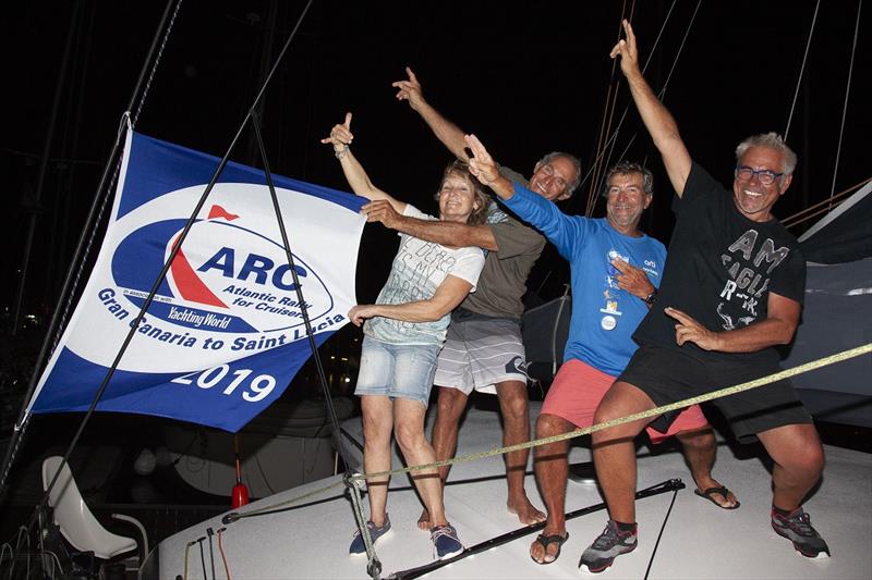 The crew, Régis Guillemot, his wife Veronique Le Gall, Yves Pellisson and Pierre Louis Delarue were jubilant to reach Saint Lucia in an elapsed time of 11 days, 16 hours, 52 minutes and 47 seconds photo copyright Clare Pengelly taken at  and featuring the Cruising Yacht class