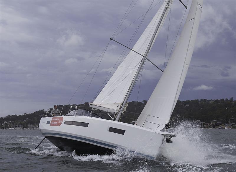Making great headway to outrun the impending downpour - Jeanneau Sun Odyssey 490 photo copyright John Curnow taken at Royal Prince Alfred Yacht Club and featuring the Jeanneau class