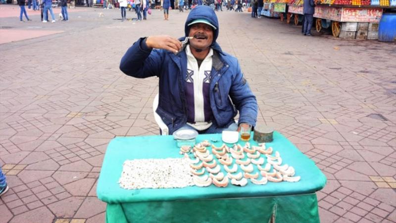 Vendor selling teeth and used dentures in the Jemaa el-Fnaa square Marrakesh - photo © SV Red Roo