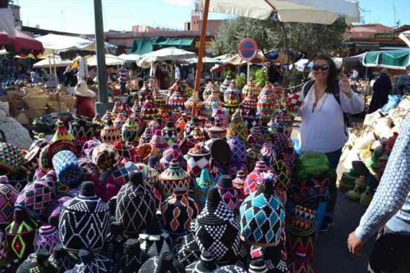 Maree trying to pick one pot from the many colour combinations on offer - photo © SV Red Roo