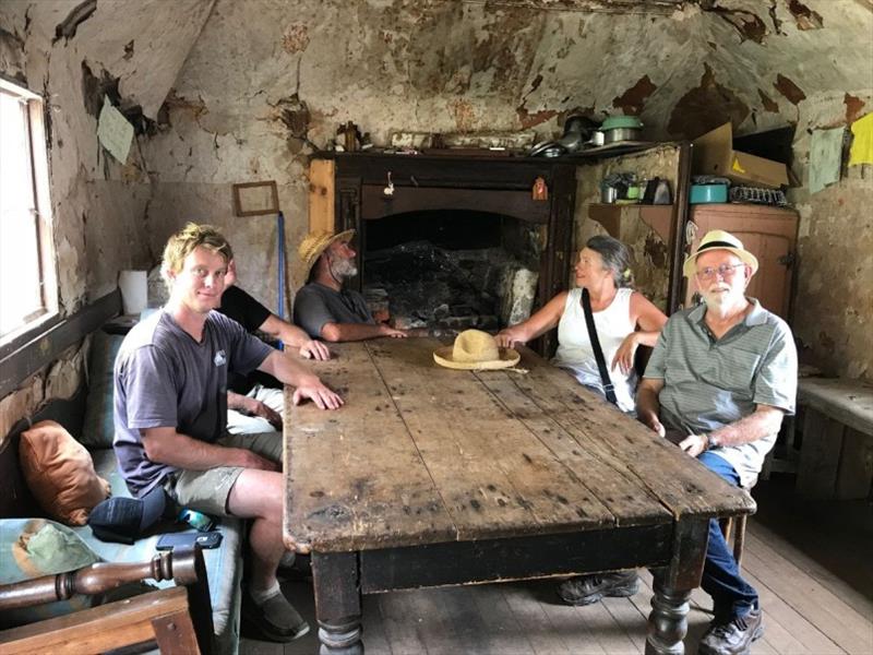 Inside the shack, Jimmy and Garry Kerr in the foreground. Just like it was left 100 years ago. (You don't see this sort of thing in The Whitsundays) photo copyright Tim Phillips taken at 
