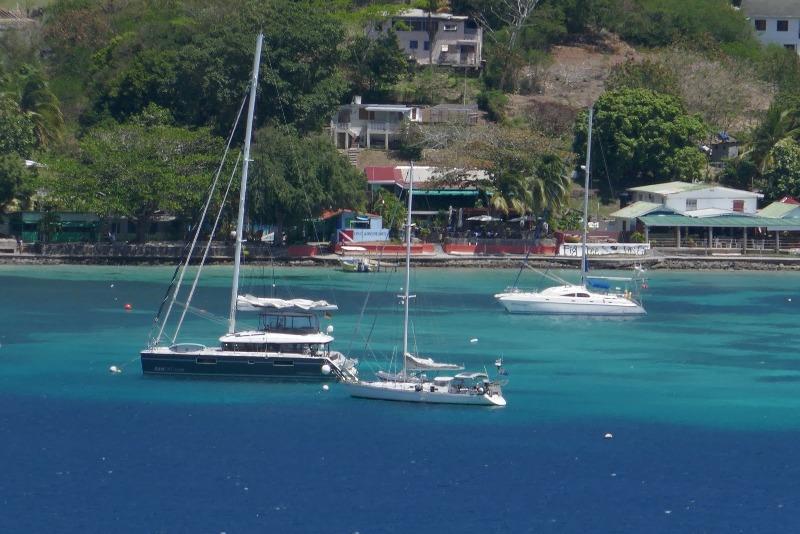 Taipan on a mooring in Bequia next to a block of flats!! - photo © SV Taipan