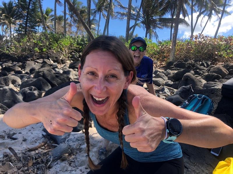 Dr. Michelle Barbieri and Lindsey Bull perform a happy dance after discovering a gravid female green sea turtle on Oahu's North Shore. - photo © NOAA Fisheries / Camryn Allen