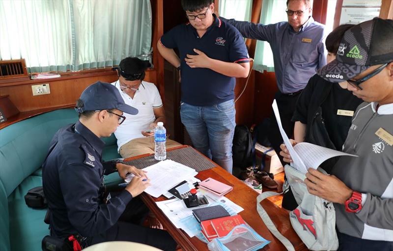 Prior to departure, ICA Officer clearing documents on-board Raffles Marina's very own, Lady Olivia  photo copyright Ng Ai Li taken at 
