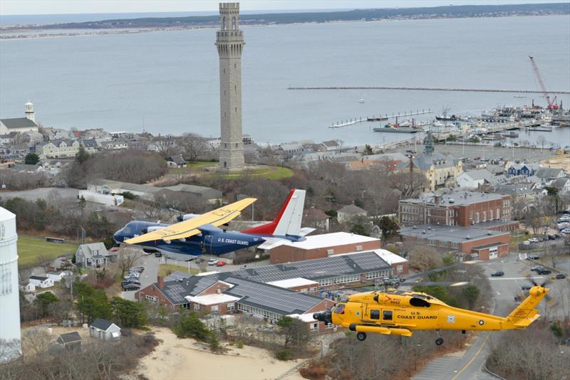 The centennial HC-144 Ocean Sentry airplane and MH-60 Jayhawk helicopter fly past the Pilgrim monument in Provincetown, Massachusetts, Monday, Dec. 16, 2019. Air Station Cape Cod has a crew complement of 180 personnel. - photo © Petty Officer 2nd Class Nicole J. Groll