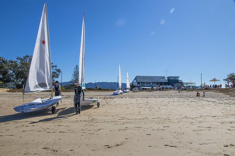 The AST Laser Squad take the very short stroll down to the beach form the Coffs Harbour Yacht Club. - photo © John Curnow