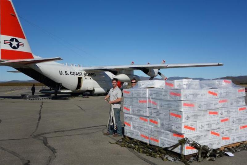 The U.S. Coast Guard delivers donated seafood to Nome, Alaska, in 2018. Simon Kinneen, current chairman of the North Pacific Fishery Management Council helps distribute it photo copyright Jim Harmon / SeaShare taken at 