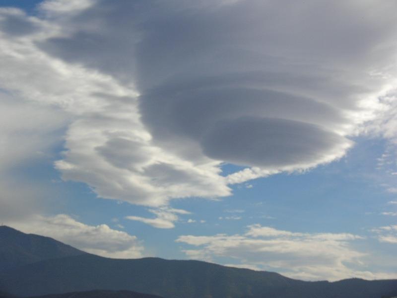 Conical white cloud over Motril photo copyright Hugh & Heather Bacon taken at 