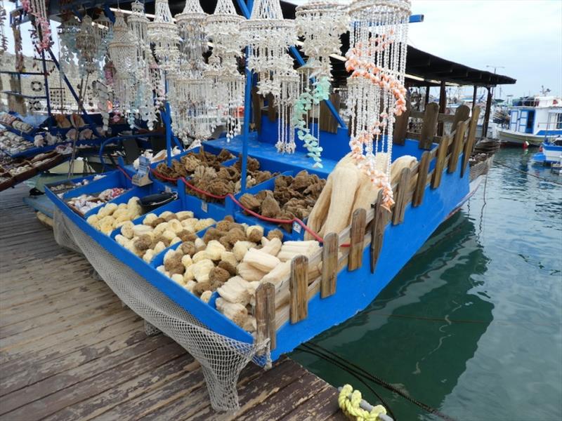 Selling sea sponges and shells at Rhodes Harbour photo copyright SV Red Roo taken at 