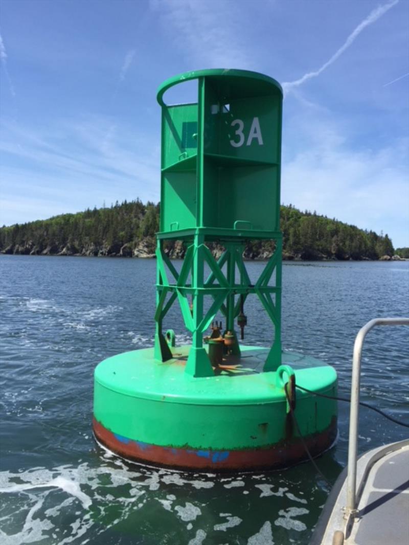 The space in which a sound signaling brass bell typically hangs on this offshore buoy is empty after the bell was stolen, off the coast of Maine. Stealing a sound signaling device off a buoy is a federal offense and can be punishable with heavy fines photo copyright U.S. Coast Guard taken at  and featuring the Power boat class