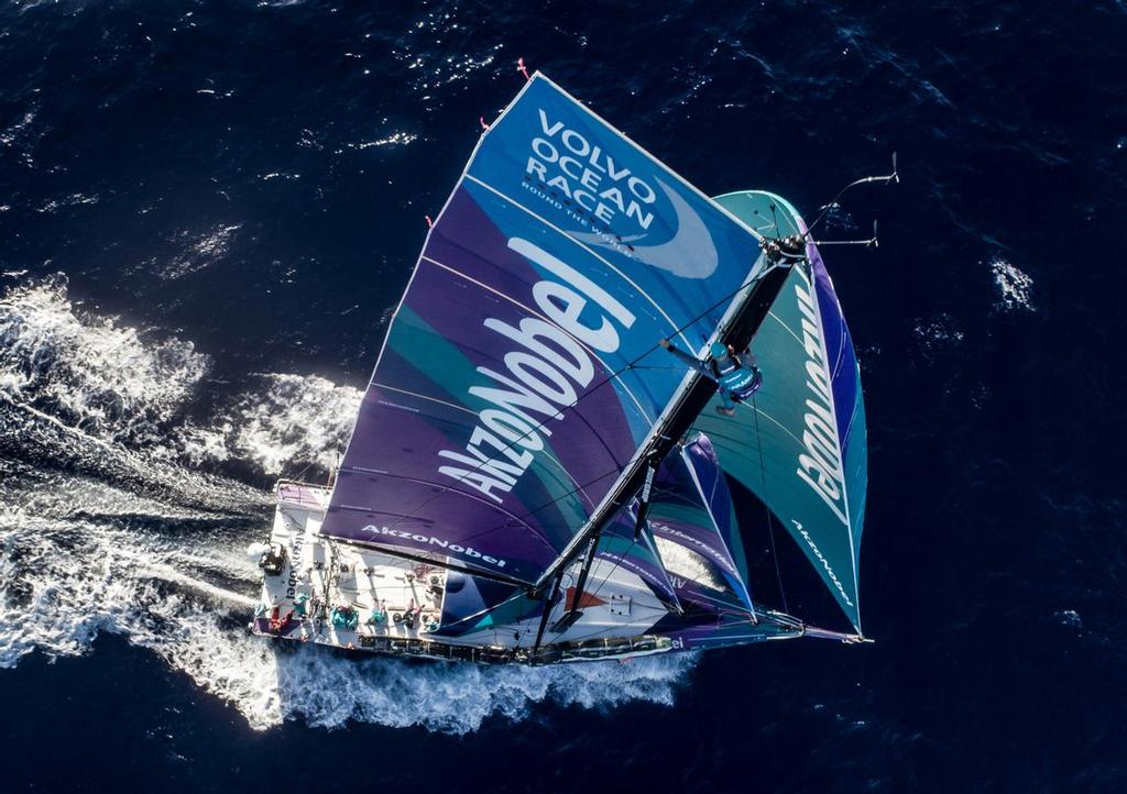 Leg 02, Lisbon to Cape Town, day 14,  on board AkzoNobel. Brad Farrand in an alomost Chameleon like state with the matching wet weather gear up the mast. He is doing a rig check before the winds start to pick up later today. Photo by James Blake/Volvo Ocean Race. 18 November, 2017. photo copyright  James Blake / Volvo Ocean Race taken at  and featuring the  class