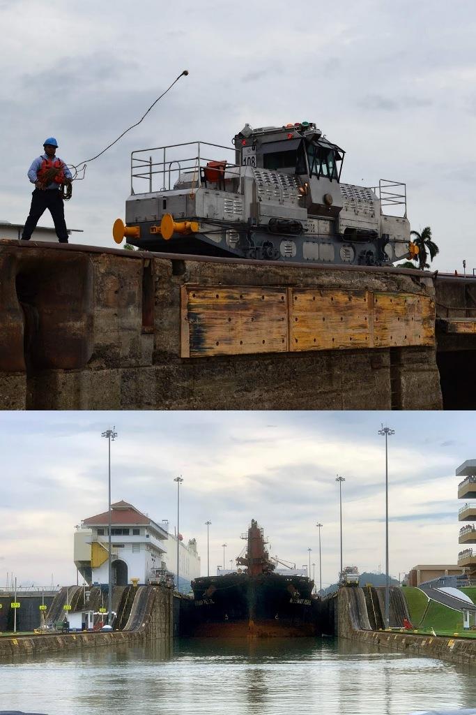 Canal staff throw the monkeys fist to attach to our lines. A freighter follows us out of Miraflores lock photo copyright SV Taipan taken at  and featuring the Taipan class