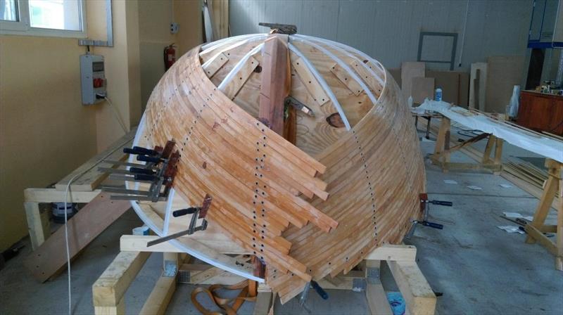 Croatian Gajeta build - The hull takes shape, with the batons held in place with screws through washers - photo © West System International