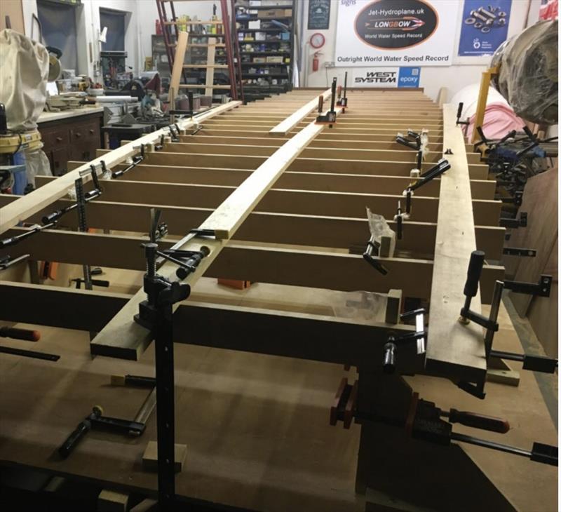 Supported by a metal frame, the first elements of the hydroplane's hull are being assembled (August 2018) photo copyright Wessex Resins & Adhesives taken at  and featuring the  class
