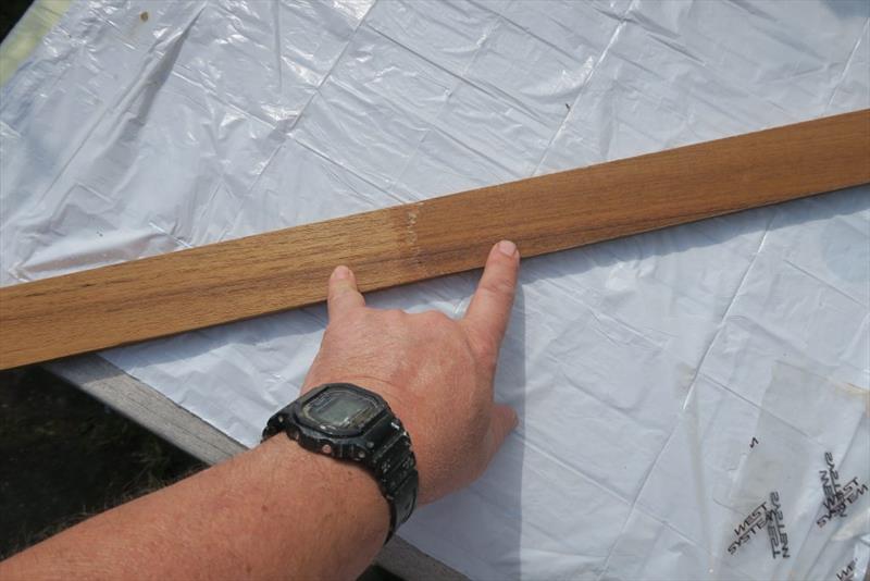 You can see the comparison between the untreated teak (little finger) and the prepared teak (index finger) - photo © Wessex Resins & Adhesives